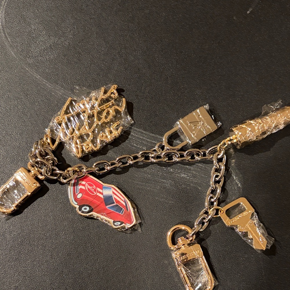 Louis Vuitton Gold Tone Charm Keychain with Red Car Charm